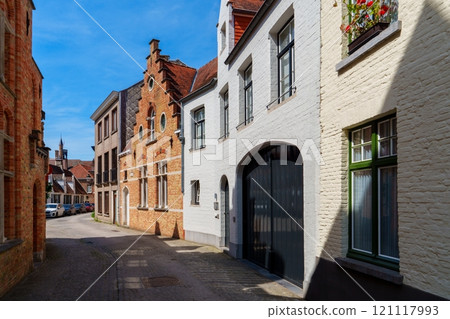 Narrow street with old houses in the historic city center of Bruges, Belgium 121117993
