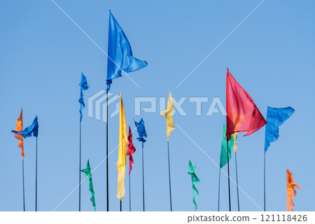 Colored flags against the sky 121118426