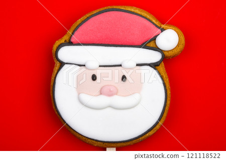 Santa Claus gingerbread cookie pop on red background Santa Claus gingerbread cookie pop on red background 121118522