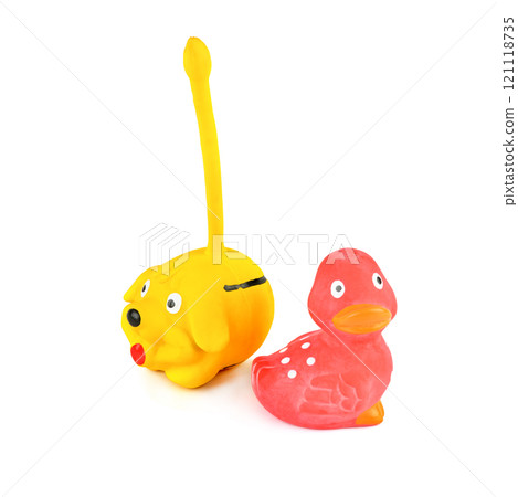 Pet toys (rubber dog and duck) isolated on white. Pet toys (rubber dog and duck) isolated on white. 121118735