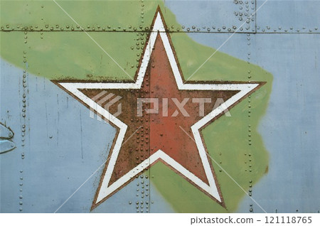 The symbol of the Soviet Union is a red star. A star on the fuselage of an old military helicopter. The symbol of the Soviet Union is a red star. A star on the fuselage of an old military helicopter. 121118765