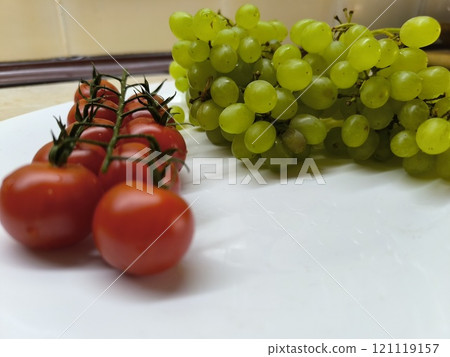 Green ripe juicy grapes on the table. Green ripe juicy grapes on the table. 121119157