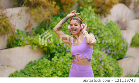 A Joyful Woman Dancing Outdoors in a Stylish and Colorful Workout Outfit Full of Energy A Joyful Woman Dancing Outdoors in a Stylish and Colorful Workout Outfit Full of Energy 121119748