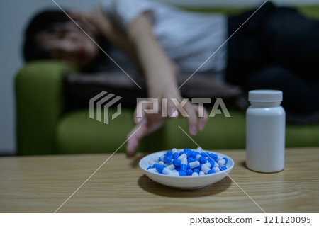 Overdose, OD image, woman taking a large amount of medicine, drug overdose, stress, depression, overtime, fatigue, overwork 121120095