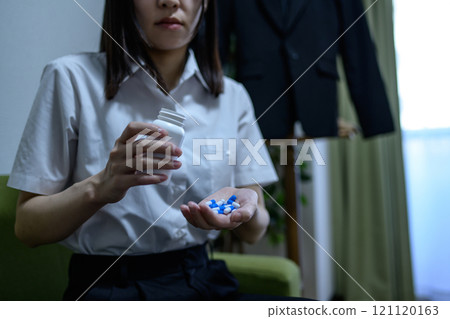 Overdose, OD image, woman taking a large amount of medicine, drug overdose, stress, depression, overtime, fatigue, overwork 121120163