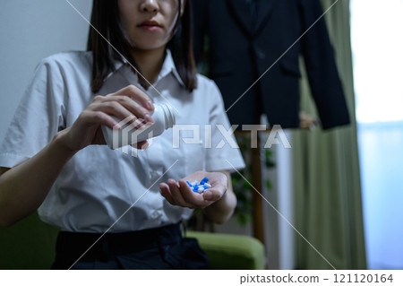 Overdose, OD image, woman taking a large amount of medicine, drug overdose, stress, depression, overtime, fatigue, overwork 121120164