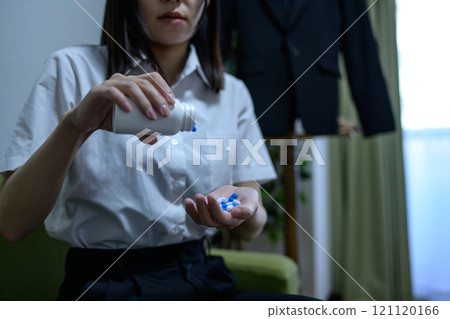 Overdose, OD image, woman taking a large amount of medicine, drug overdose, stress, depression, overtime, fatigue, overwork 121120166