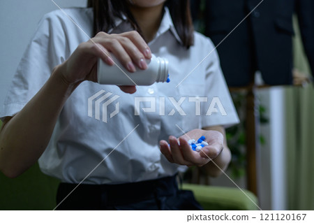 Overdose, OD image, woman taking a large amount of medicine, drug overdose, stress, depression, overtime, fatigue, overwork 121120167