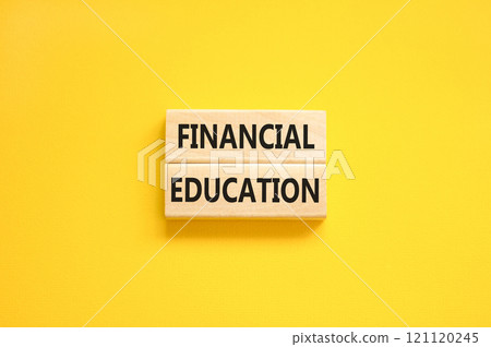 Financial education symbol. Concept words Financial education on beautiful wooden block. Beautiful yellow paper background. Business Financial education concept. Copy space. Financial education symbol. Concept words Financial education on beautiful wooden block. Beautiful yellow paper background. Business Financial education concept. Copy space. 121120245