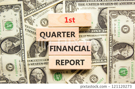 1st quarter financial report symbol. Concept words 1st quarter financial report on beautiful wooden blocks. Beautiful dollar background. Business 1st quarter financial report concept. Copy space. 1st quarter financial report symbol. Concept words 1st quarter financial report on beautiful wooden blocks. Beautiful dollar background. Business 1st quarter financial report concept. Copy space. 121120273