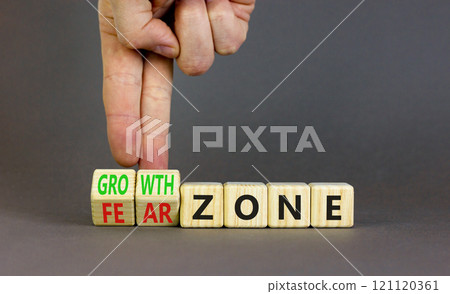 Growth or fear zone symbol. Concept words Growth zone Fear zone on wooden cubes. Beautiful grey table grey background. Psychologist hand. Business and growth or fear zone concept. Copy space. 121120361
