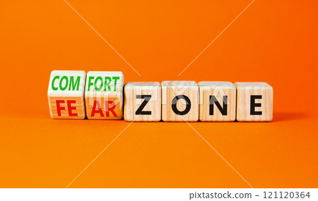 Comfort or fear zone symbol. Concept words Comfort zone Fear zone on wooden cubes. Beautiful orange table orange background. Business and comfort or fear zone concept. Copy space. 121120364