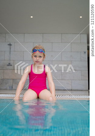 Girl in swimsuit by the pool Girl in swimsuit by the pool 121120590