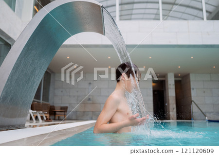 Teen enjoying water therapy spa 121120609
