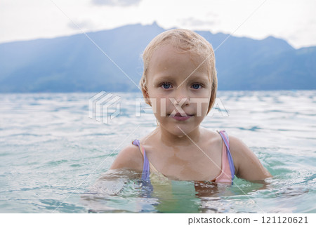 Young girl swimming in lake Young girl swimming in lake 121120621