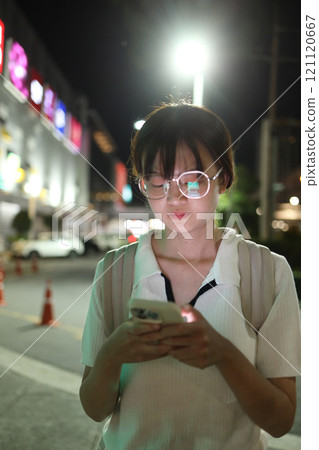 Asian Woman with Smart Phone 121120667