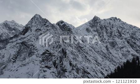 Snow-Covered Mountain Peaks and Clouds in Kalam, North Pakistan Snow-Covered Mountain Peaks and Clouds in Kalam, North Pakistan 121121910