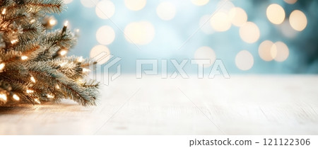 Glowing Christmas Tree on Light Blue Bokeh Blurred Background. Winter Holidays Advertising Banner with Copy Space for Text. Glowing Christmas Tree on Light Blue Bokeh Blurred Background. Winter Holidays Advertising Banner with Copy Space for Text. 121122306