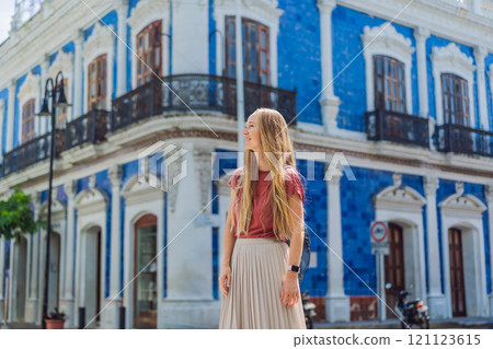 Female tourist in front of Casa de los Azulejos in Villahermosa, Mexico. Quintana Roo travel, cultural exploration, and historic architecture concept 121123615
