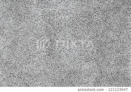 Gray color fabric cloth with short haired fluffy and soft abstract texture background. Photo silver colored surface level textile material, background texture of fabric for design element. Copy space 121123647