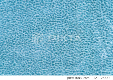 Light blue color velvet with short haired fluffy and soft texture background. Closeup of sapphire colour surface velour textile material, background fabric texture, free copy space for creative design 121123652