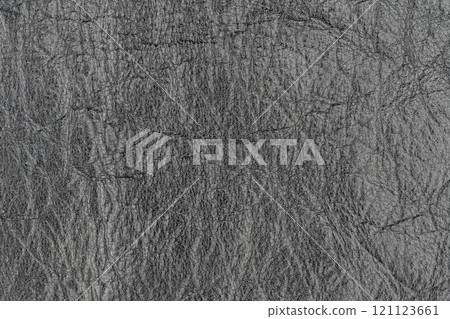 Abstract dark gray color artificial leather pattern for background. Close-up photo of shadow light black color surface level imitation leather material, wrinkle background texture, free copy space Abstract dark gray color artificial leather pattern for background. Close-up photo of shadow light black color surface level imitation leather material, wrinkle background texture, free copy space 121123661
