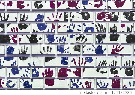 Hand shapes marked on a wall with paint Hand shapes marked on a wall with paint 121123726