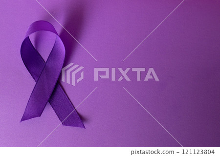 Purple background with International Cancer Day symbol .Copy space 121123804