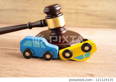 Car accident lawsuit and insurance, Judge hammer with car model. Car accident lawsuit and insurance, Judge hammer with car model. 121124135