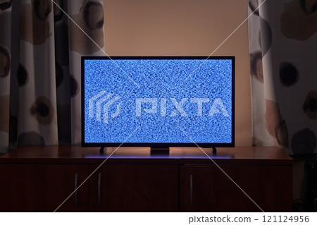 TV in a dim living room 121124956