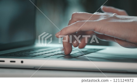 Laptop keyboard hands typing close up. Woman remote job from home office. Student professional study work with pc. Software, online education, apps, modern tech concept. Blue toning filter, side view 121124972