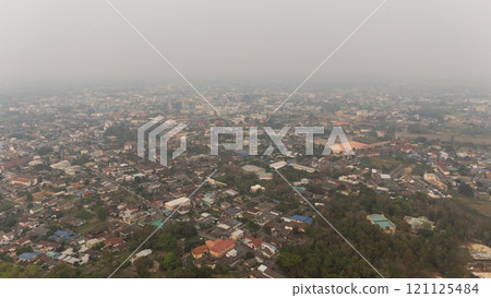 Aerial view of an environment in Chiang Rai city covered with bad air pollution such as PM 2.5. PM2.5, A harmful thing is toxic air pollution. 121125484