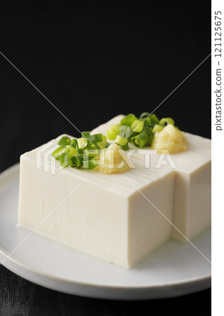 Cold silken tofu topped with spring onions and ginger Cold silken tofu topped with spring onions and ginger 121125675
