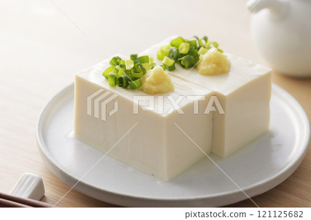 Cold silken tofu topped with spring onions and ginger Cold silken tofu topped with spring onions and ginger 121125682