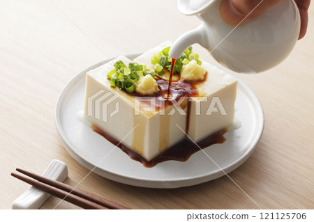 Cold silken tofu topped with spring onions and ginger Cold silken tofu topped with spring onions and ginger 121125706