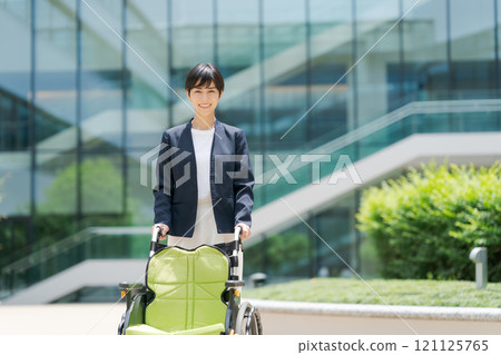 A woman in a wheelchair and a suit A woman in a wheelchair and a suit 121125765