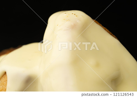 Spread melted cheese on baguette Spread melted cheese on baguette 121126543