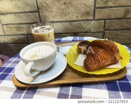 Coffee cup with croissants buns and ice coffee glass, morning breakfast meal or coffee 121127833