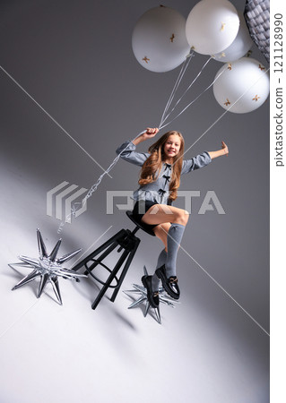 Joyful Girl with Balloons Set in a Beautiful and Artistic Creative Setting of Life 121128990