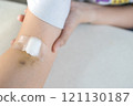 Close up,Arm of woman with bruise on foldable joint after taking blood sample,plaster and cotton to cover wound,painful in arm,concept of blood test,medical examination,health checkup,blood donation 121130187