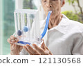 Senior patient using incentive spirometer,tool to help the lung expansion,exercise the lung,old elderly with Tuberculosis,Asthma,problem of respiratory disease,treatment,health care,medical concept 121130568