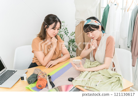 Women in the apparel industry and fashion designers who are worried about their smartphones Women in the apparel industry and fashion designers who are worried about their smartphones 121130617