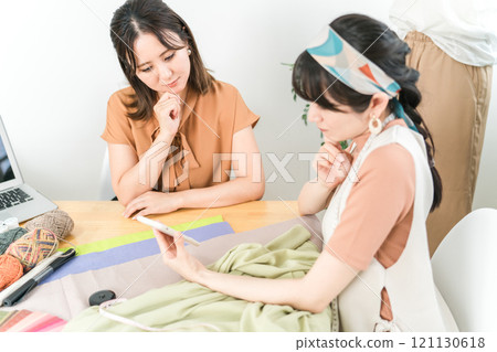 Women in the apparel industry and fashion designers who are worried about their smartphones Women in the apparel industry and fashion designers who are worried about their smartphones 121130618