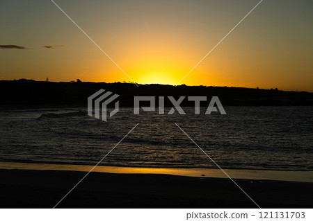 Sunrise seen from the beach at Toguchi Beach 121131703