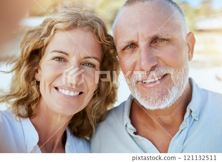 Portrait of happy mature caucasian couple taking a selfie while bonding together on holiday outdoors. Loving husband and wife capturing photos for memories while enjoying retirement and vacation 121132511