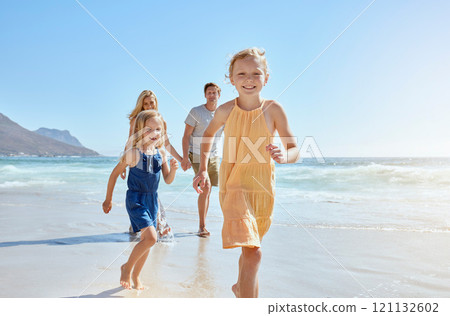 Joyful young family with two children running on the beach and enjoying a fun summer vacation. Two energetic little girls having a race while their mother and father follow in the background Joyful young family with two children running on the beach and enjoying a fun summer vacation. Two energetic little girls having a race while their mother and father follow in the background 121132602