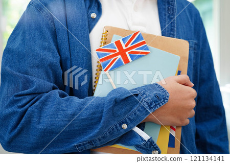 Learn English language, Asian teenage student hold book with flag in course at school. Learn English language, Asian teenage student hold book with flag in course at school. 121134141