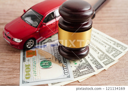 Car accident lawsuit and insurance, Judge hammer and money with car model. 121134169