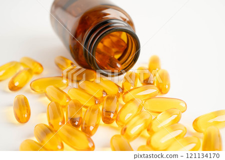 Fish oil or Cod liver oil gel in capsules with omega 3 vitamins, supplementary healthy food. 121134170
