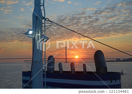 Akashi Kaikyo Bridge and ferry funnel at sunrise 121134461